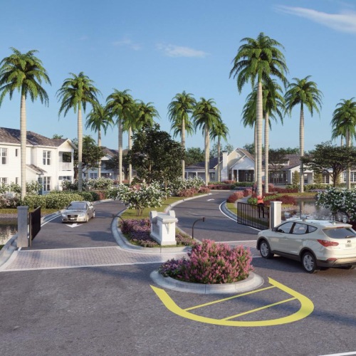 a entrance to a apartment complex with palm trees and cars