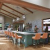 lounge with large kitchen seating and multiple tvs