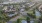 an aerial view of an apartment complex and small bodies of water