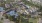 an aerial view of an apartment complex and small bodies of water