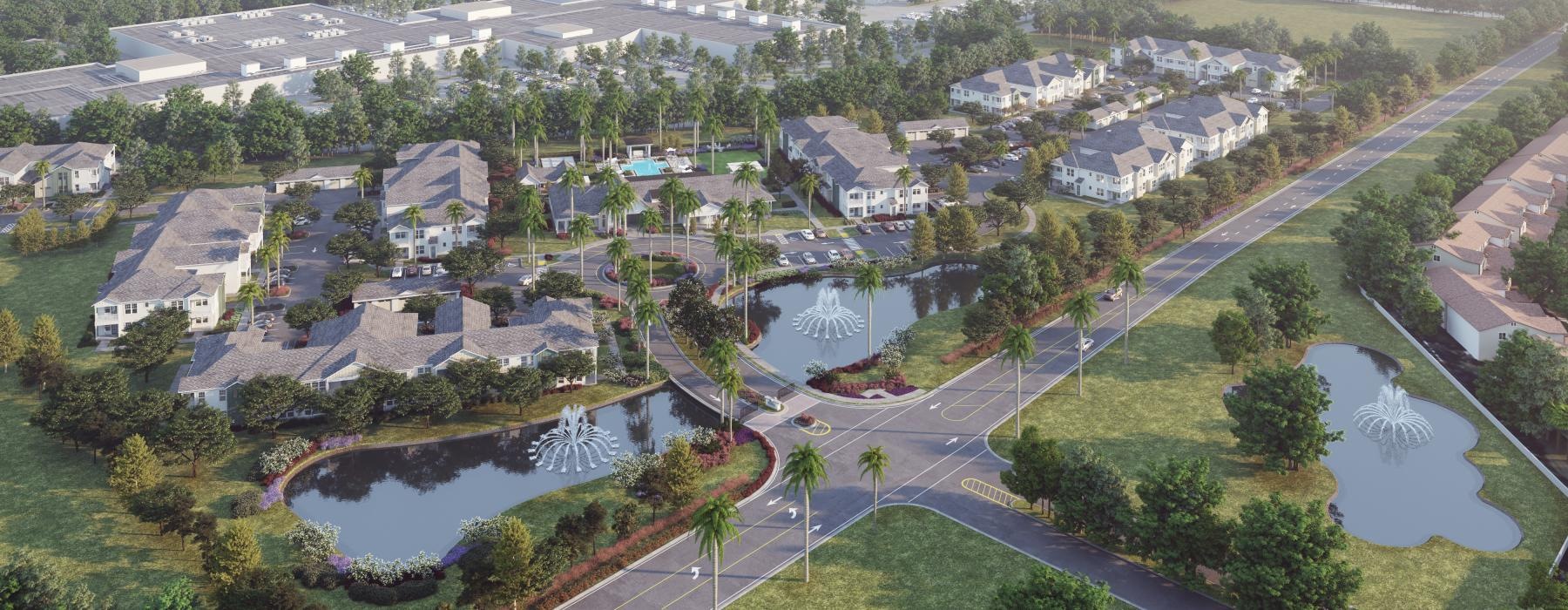 an aerial view of an apartment complex and small bodies of water