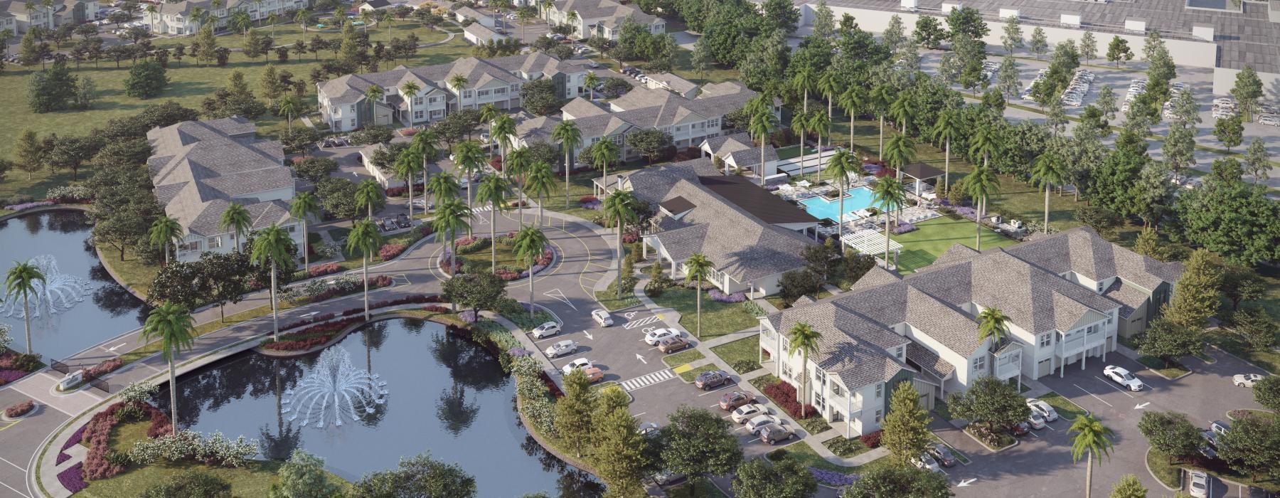 an aerial view of an apartment complex and small bodies of water